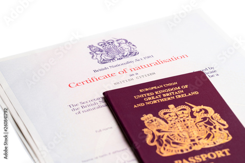 Image of the new issued pre brexit style British passport with naturalization certificate