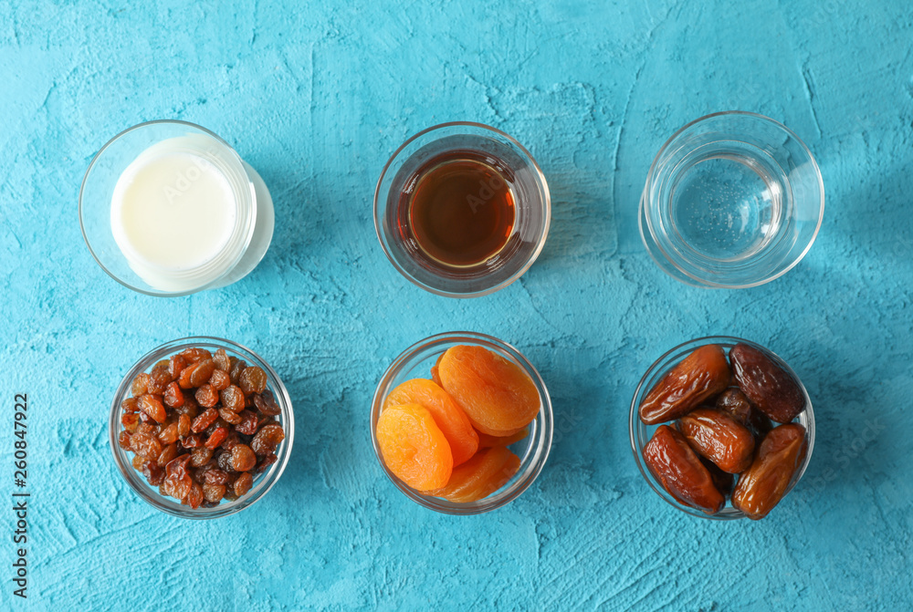 Flat lay composition with Ramadan Kareem food on color background Flat lay composition with Ramadan Kareem food on color background