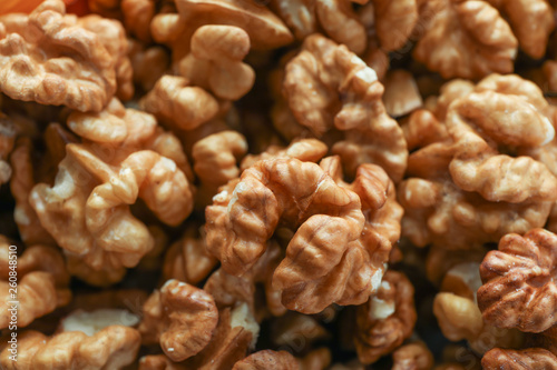 Delicious fresh walnuts kernels as background, closeup