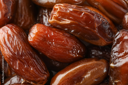 Delicious raw organic dates as background, closeup