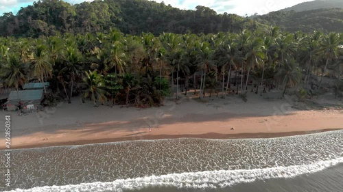 Woman walking at the lonely beach, orbitflight