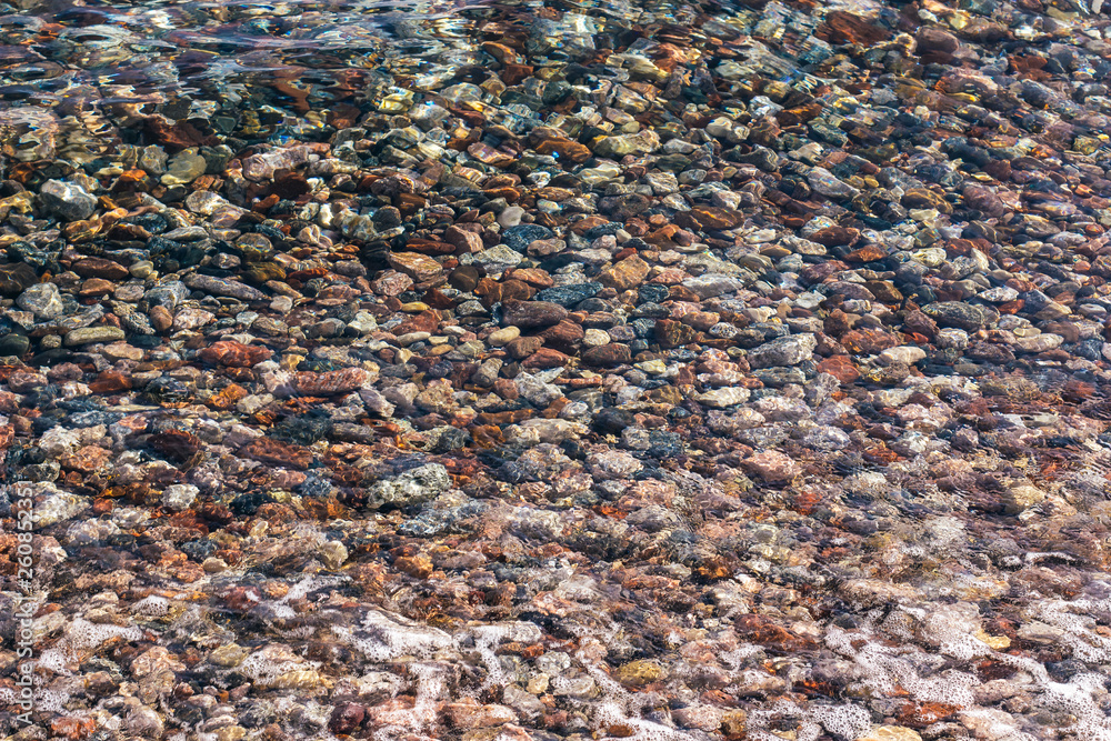 transparent water and unfocused colorful stone bottom abstract unfocused fuzzy natural scenic background, summer concept photography transparent water and unfocused colorful stone bottom abstract unfocused fuzzy natural scenic background, summer concept photography