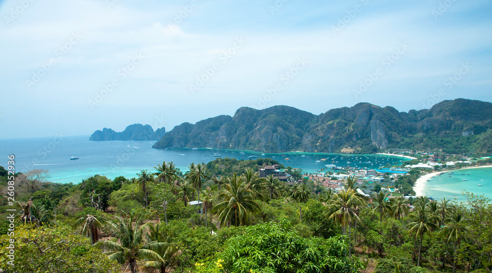 Beautiful view of the island with thin isthmus and two bays. Green mountains and tropic plants. Tropical island in the ocean, Phi-Phi island. Thailand.