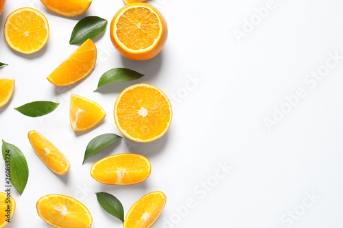 Composition with ripe oranges on white background, top view