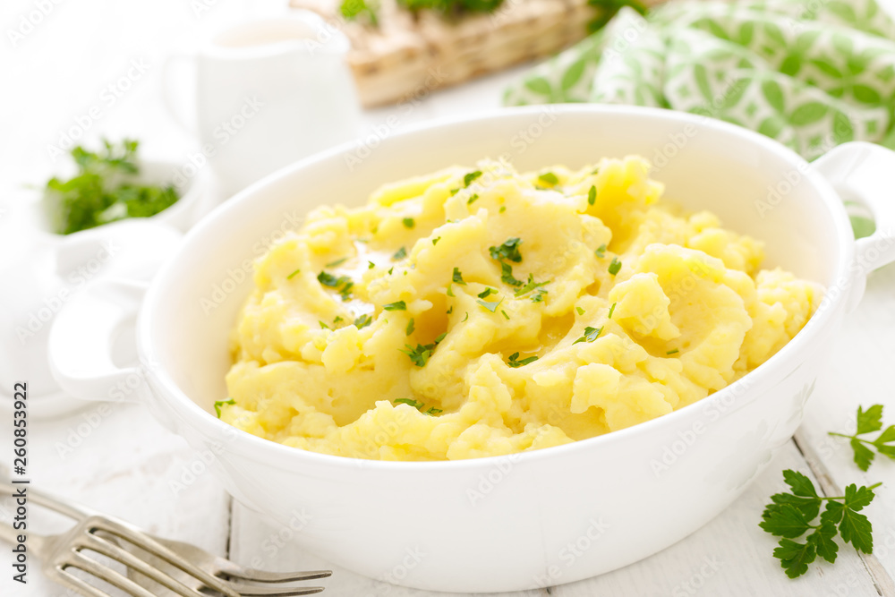 Mashed potato with butter and milk on table Mashed potato with butter and milk on table
