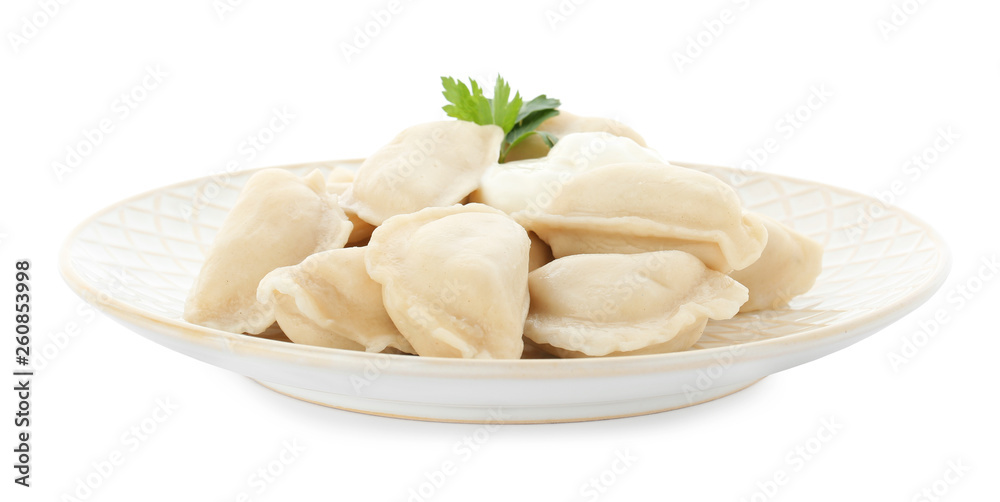 Plate of tasty dumplings with sour cream and parsley isolated on white Plate of tasty dumplings with sour cream and parsley isolated on white