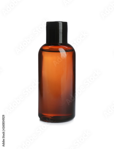 Mini bottle with cosmetic product on white background. Hotel amenity