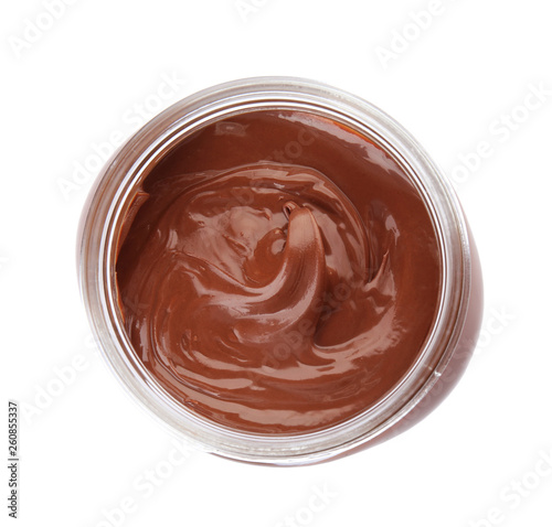 Glass jar with tasty chocolate cream isolated on white, top view