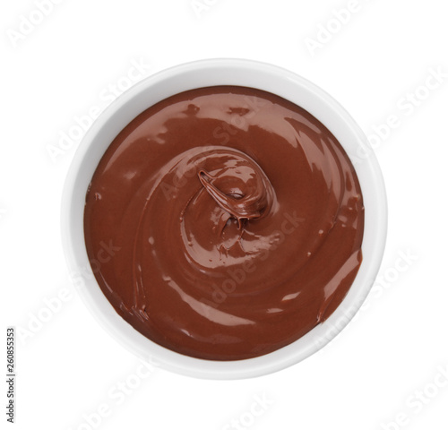 Bowl of sweet chocolate cream isolated on white, top view
