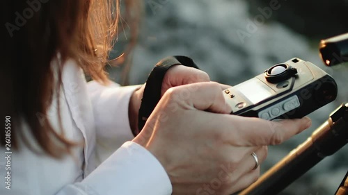 Photographer professional makes metering exposure meter.