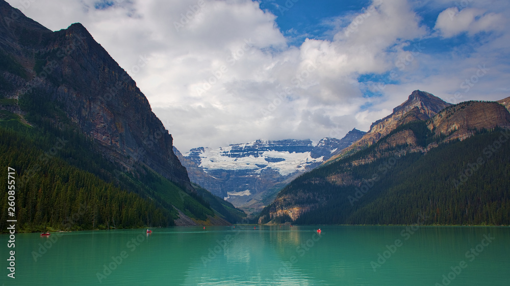 Lake Louise on a fun summer day. Water Activities. Rocky mountain canada ( Canadian Rockies ). Near the city of Calgary. Portrait, fine art. Banff National Park, Alberta, Canada: August 4, 2018
