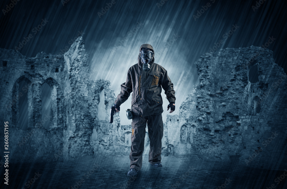 Fototapeta premium Hazard, menace man in a ruined crumbly building with arms on his hand 