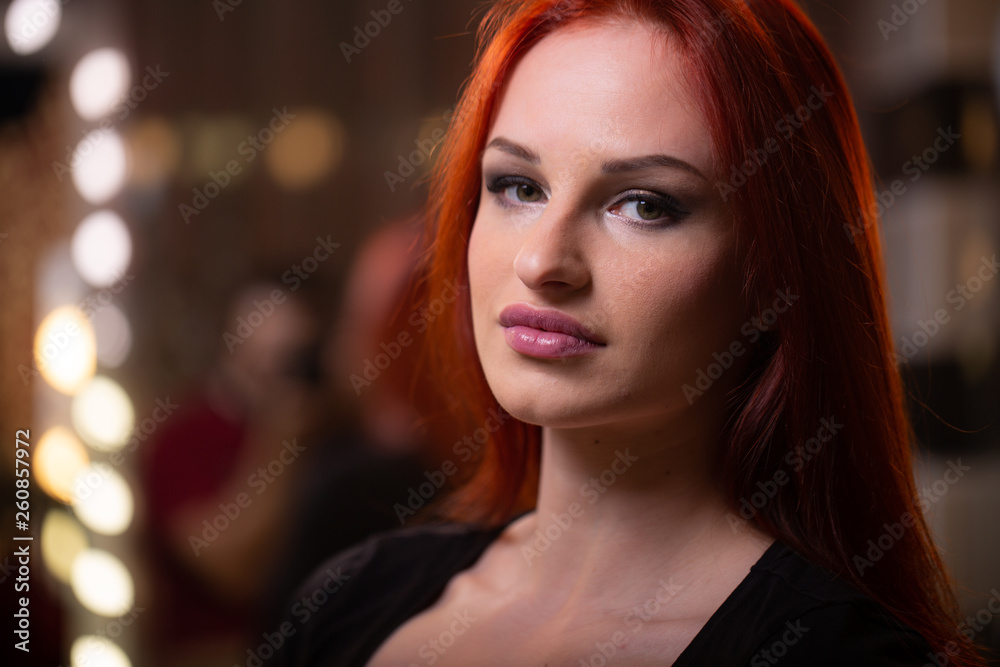 Portrait of woman with long red beautiful ginger hair.