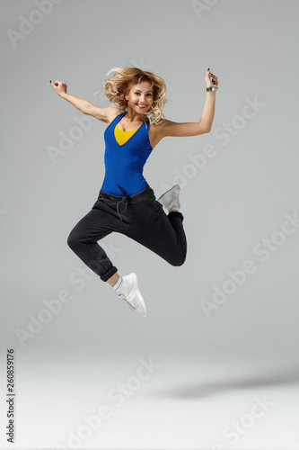 Hip hop dancer moving and jumping in photostudio © Alexander Y