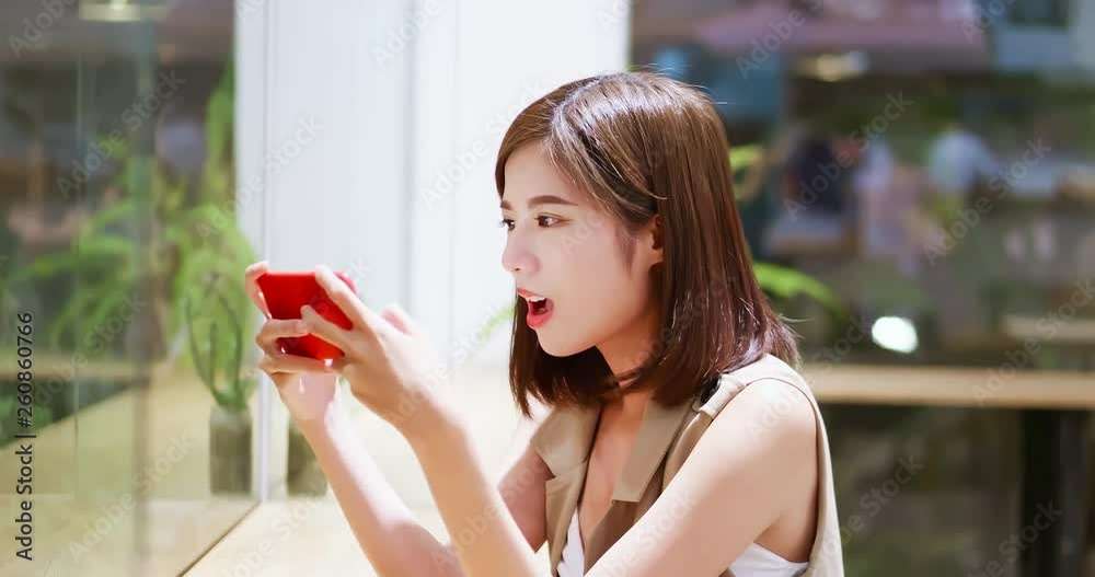 Young woman play mobile game Young woman play mobile game