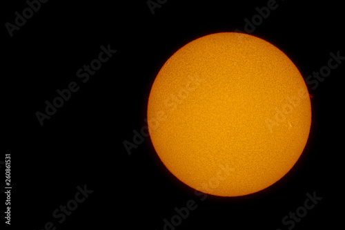 The grain-like surface of the sun with sunspots and solar flares photographed on April 7, 2019, with an H-alpha solar telescope from Seeheim-Jugenheim in Germany