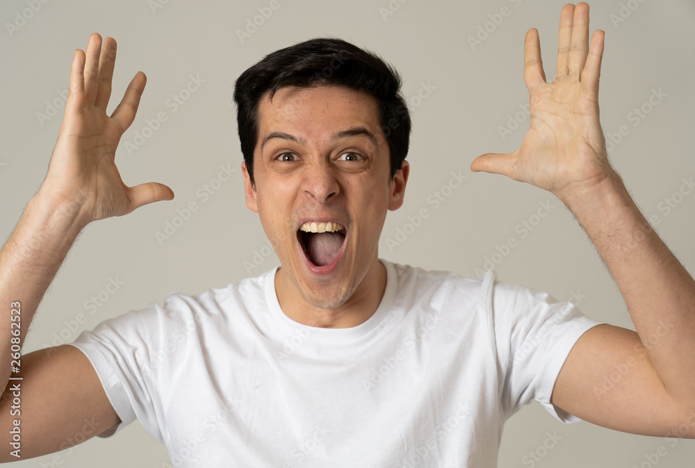 Portrait of surprised and happy man celebrating victory and winning lottery in human emotions Portrait of surprised and happy man celebrating victory and winning lottery in human emotions