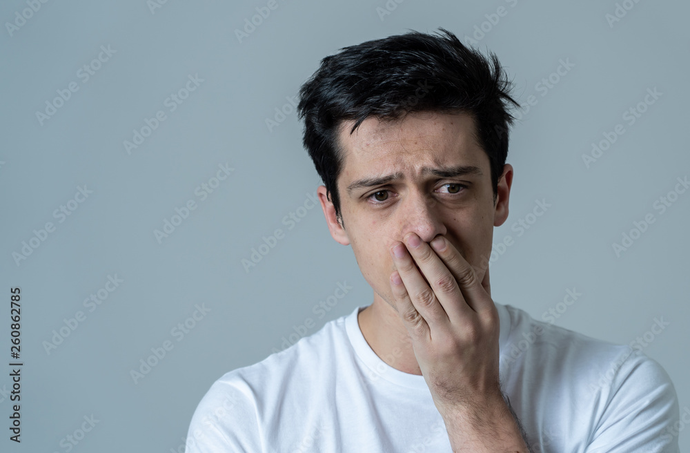 Portrait of sad and depressed man. Isolated on neutral background. Human expressions and emotions Portrait of sad and depressed man. Isolated on neutral background. Human expressions and emotions