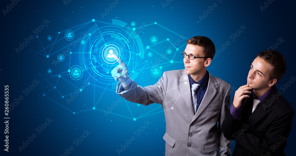 Man touching hologram screen displaying keys and locks Man touching hologram screen displaying keys and locks