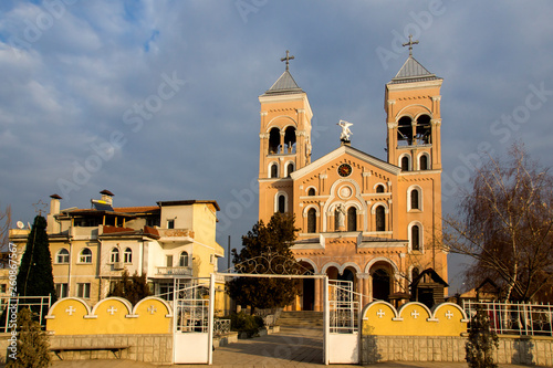 Sunset view of The Roman Catholic church of St Michael the Archangel in town of Rakovski, Bulgaria photo