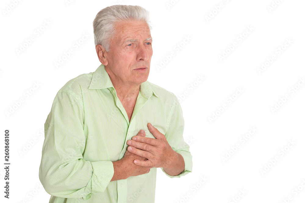 Portrait of senior man holding hands on chest Portrait of senior man holding hands on chest