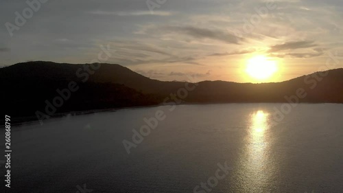 Flyover ocean beach Philippines by sunset