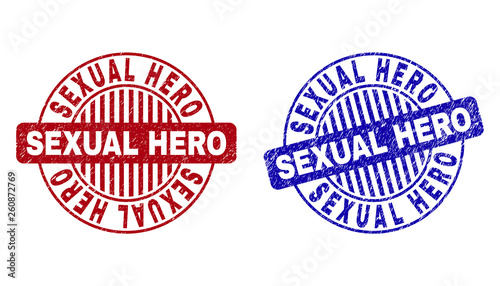 Grunge SEXUAL HERO round stamp seals isolated on a white background. Round seals with grunge texture in red and blue colors. Vector rubber imprint of SEXUAL HERO title inside circle form with stripes.