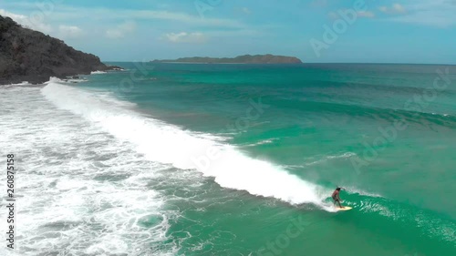 Surfer standing then falling