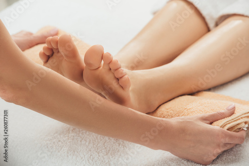 cropped view of masseur doing foot massage to adult woman in spa © LIGHTFIELD STUDIOS