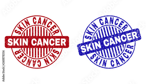 Grunge SKIN CANCER round stamp seals isolated on a white background. Round seals with grunge texture in red and blue colors.