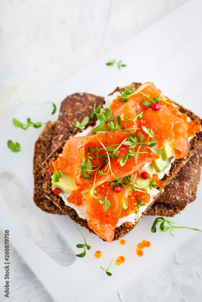 Salted salmon, red caviar, avocado and cream cheese rye crisp toast Salted salmon, red caviar, avocado and cream cheese rye crisp toast