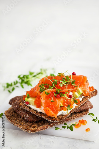 Salted salmon, red caviar, avocado and cream cheese rye crisp toast