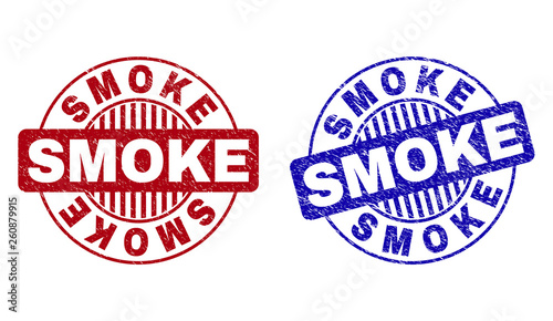 Grunge SMOKE round stamp seals isolated on a white background. Round seals with grunge texture in red and blue colors. Vector rubber overlay of SMOKE caption inside circle form with stripes.