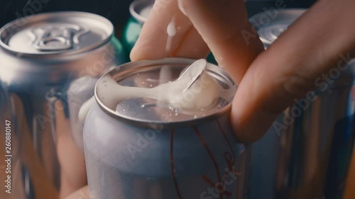 Opening unmarked soda can of fizzy cola with sound