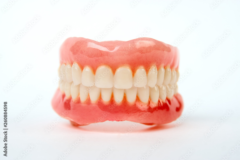 Artificial teeth on a white background with copy space Artificial teeth on a white background with copy space