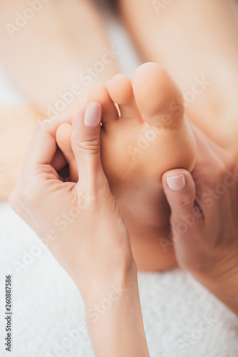 cropped view of masseur doing foot massage to adult woman in spa © LIGHTFIELD STUDIOS