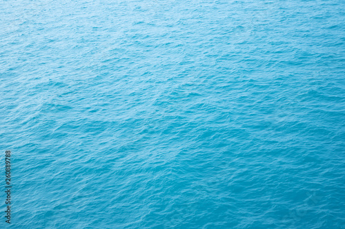 Blue Sea surface aerial view with waves from a drone, empty blank to background. soft focus.