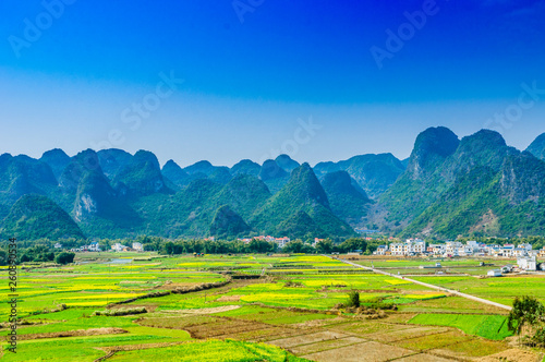 Countryside and mountain scenery with blue sky background  © carl