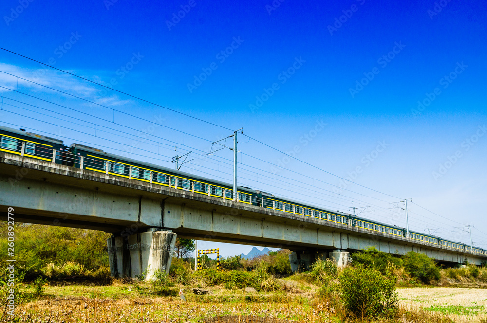 The train and bridge with blue sky background The train and bridge with blue sky background
