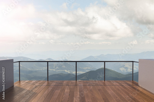 Balcony view of  mountains. Landscape. Sunny Day. Terrace with a beautiful view. Background with beautiful landscape. © nick_fedirko