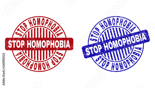 Grunge STOP HOMOPHOBIA round stamp seals isolated on a white background. Round seals with grunge texture in red and blue colors.