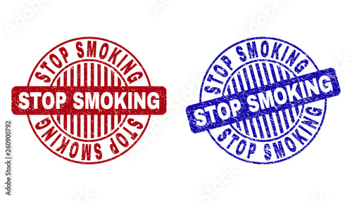 Grunge STOP SMOKING round stamp seals isolated on a white background. Round seals with distress texture in red and blue colors.