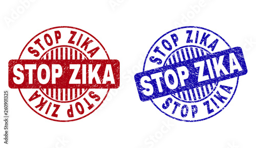 Grunge STOP ZIKA round stamp seals isolated on a white background. Round seals with grunge texture in red and blue colors. Vector rubber watermark of STOP ZIKA tag inside circle form with stripes.
