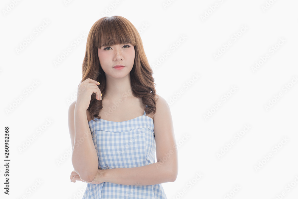 Front view close-up portrait of young beautiful Asian woman with curly long dark brown hair in light blue checked dress stand up straight isolated white background Front view close-up portrait of young beautiful Asian woman with curly long dark brown hair in light blue checked dress stand up straight isolated white background