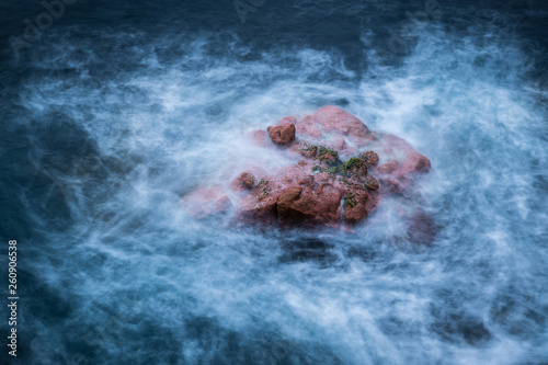 rock in the sea at Freycinet  dawn