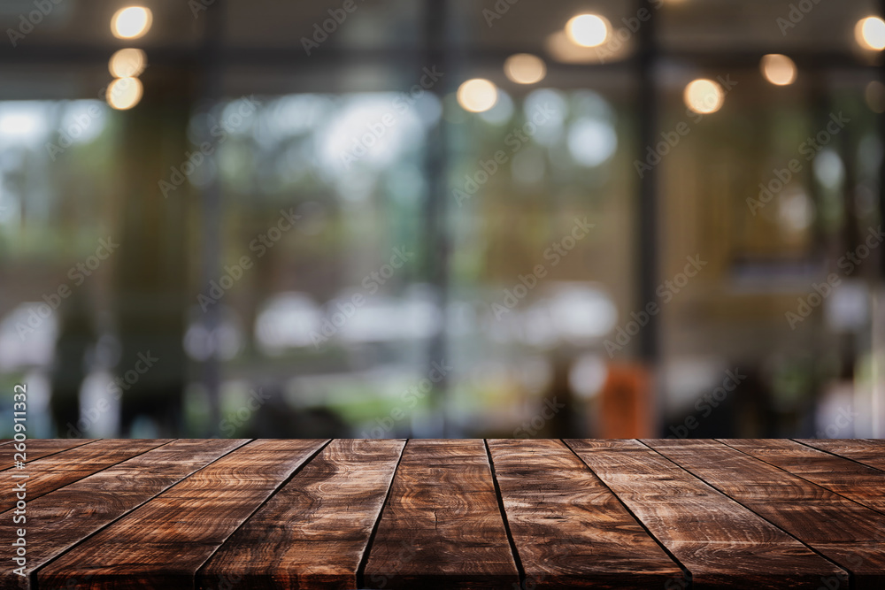 Empty wood table top on abstract blurred restaurant and cafe background - can be used for display or montage your products Empty wood table top on abstract blurred restaurant and cafe background - can be used for display or montage your products