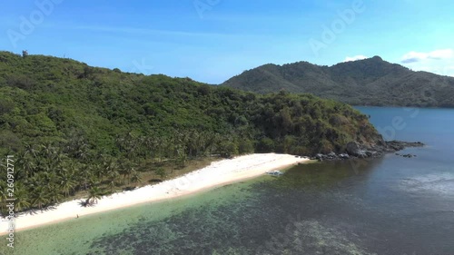 Flight over beautiful empty beach