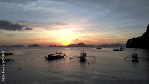 Filipino fishing boat at sunset on open water