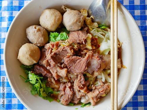 Closeup of fresh noodles soup with stewed beef (Guay Tiao Nuea) - delicious and healthy street food in Thailand photo