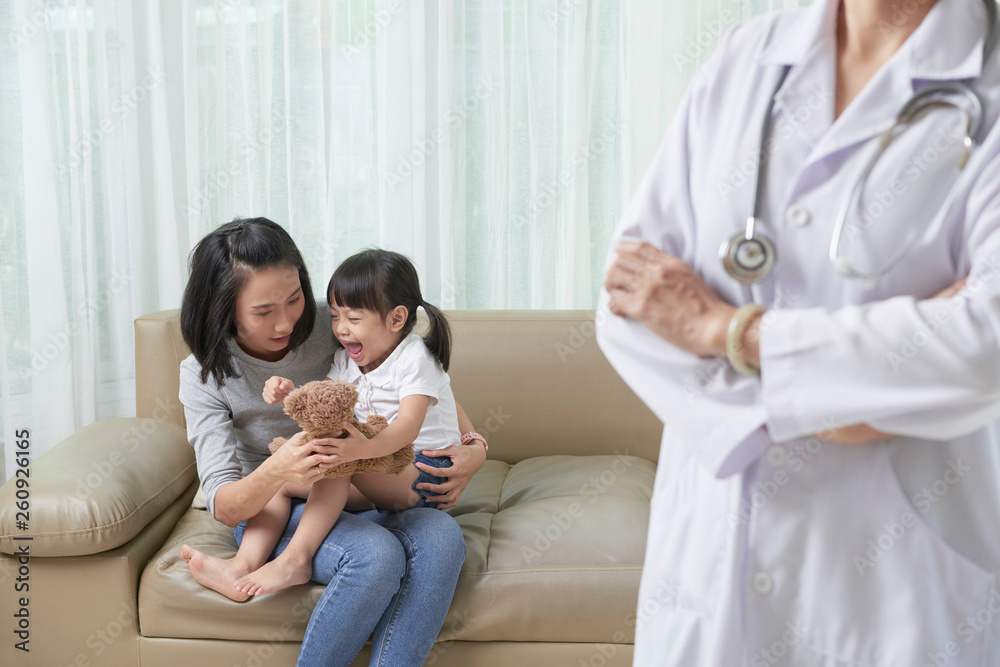 Little girl is afraid of the doctor Little girl is afraid of the doctor